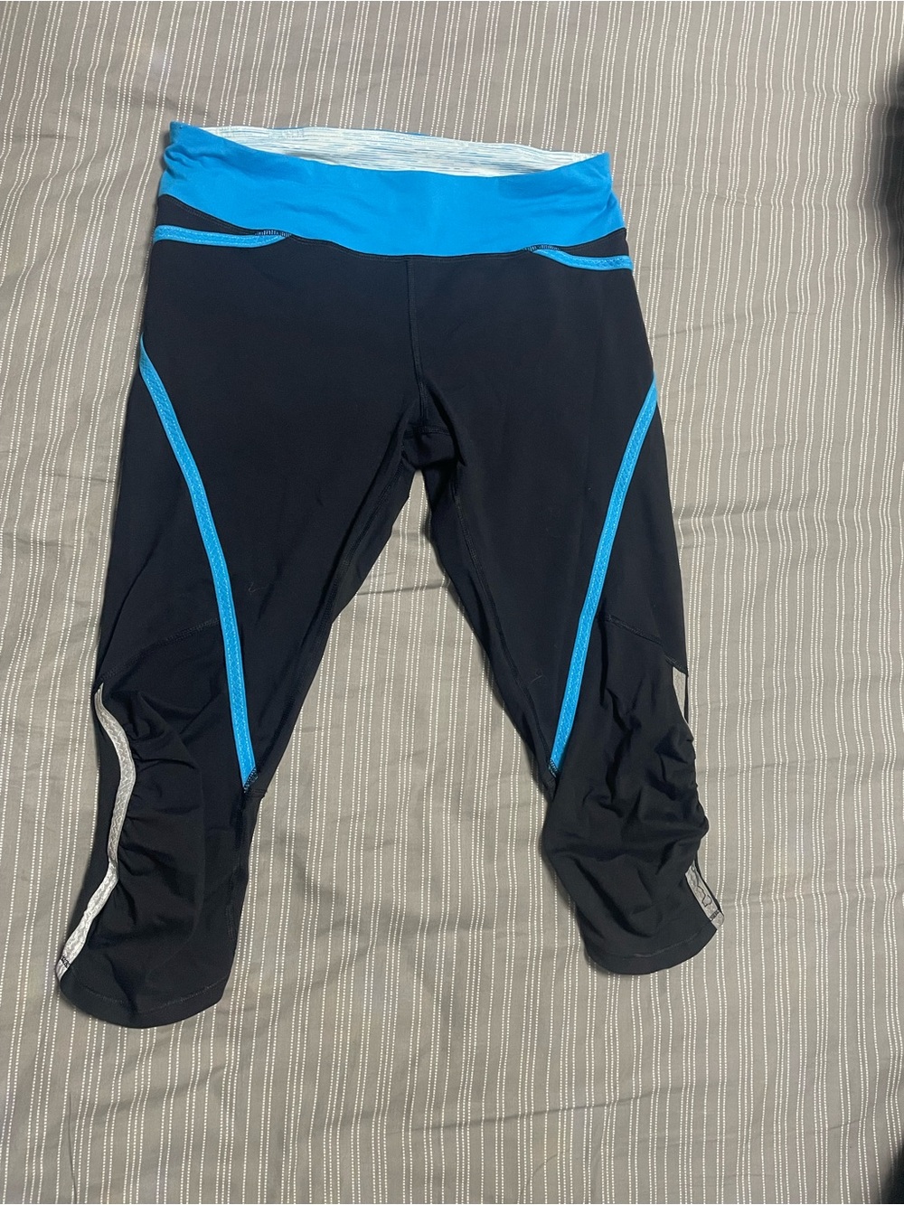 Lululemon Black Capri Workout Leggings with Bright Blue Waistband and Piping